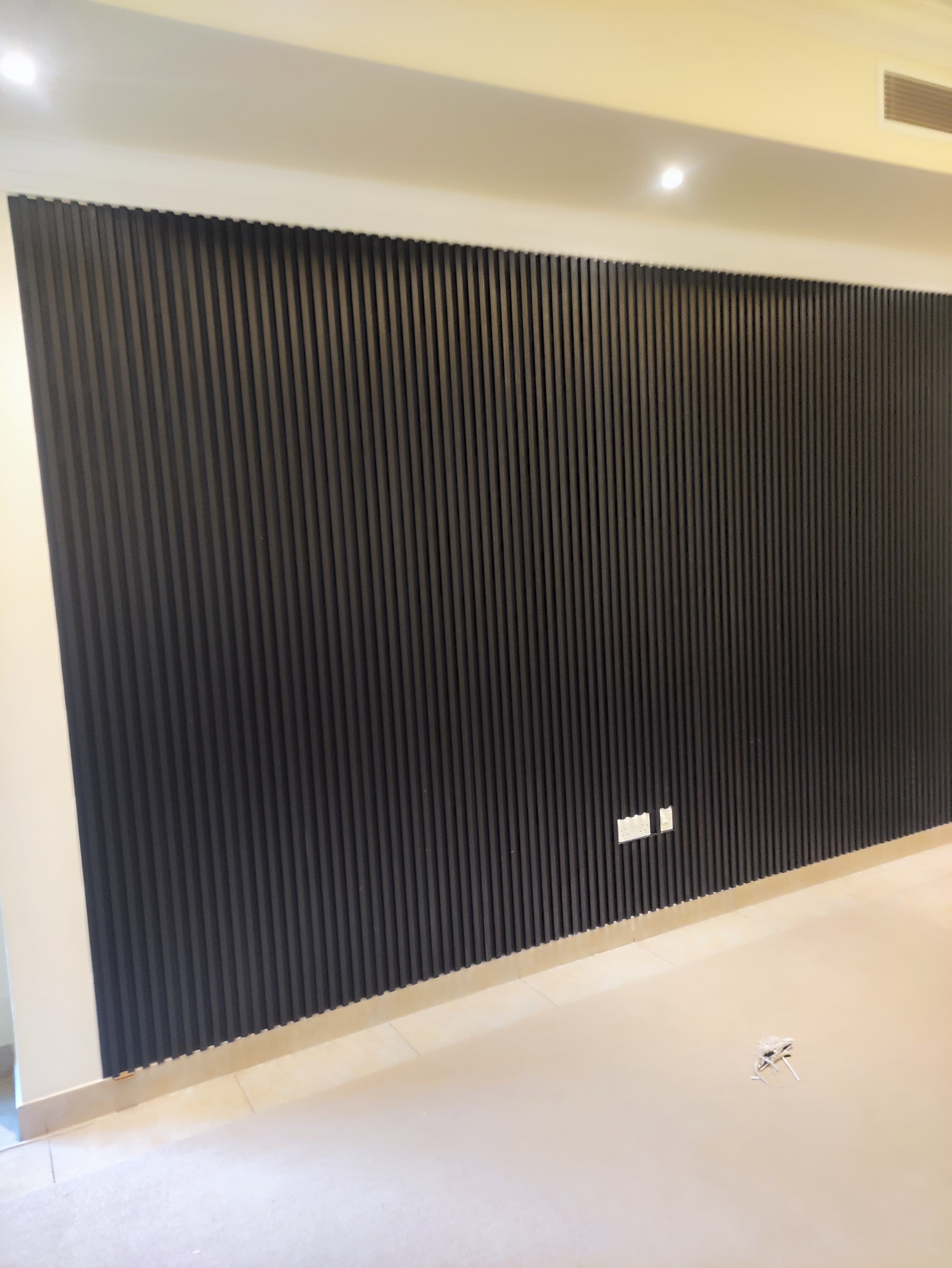 Slatted indoor wall panelling on a feature wall in a Doha home (view 2)